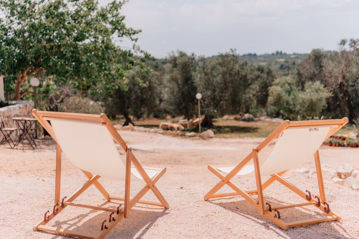 Two sun loungers facing the olive groves and rolling hills